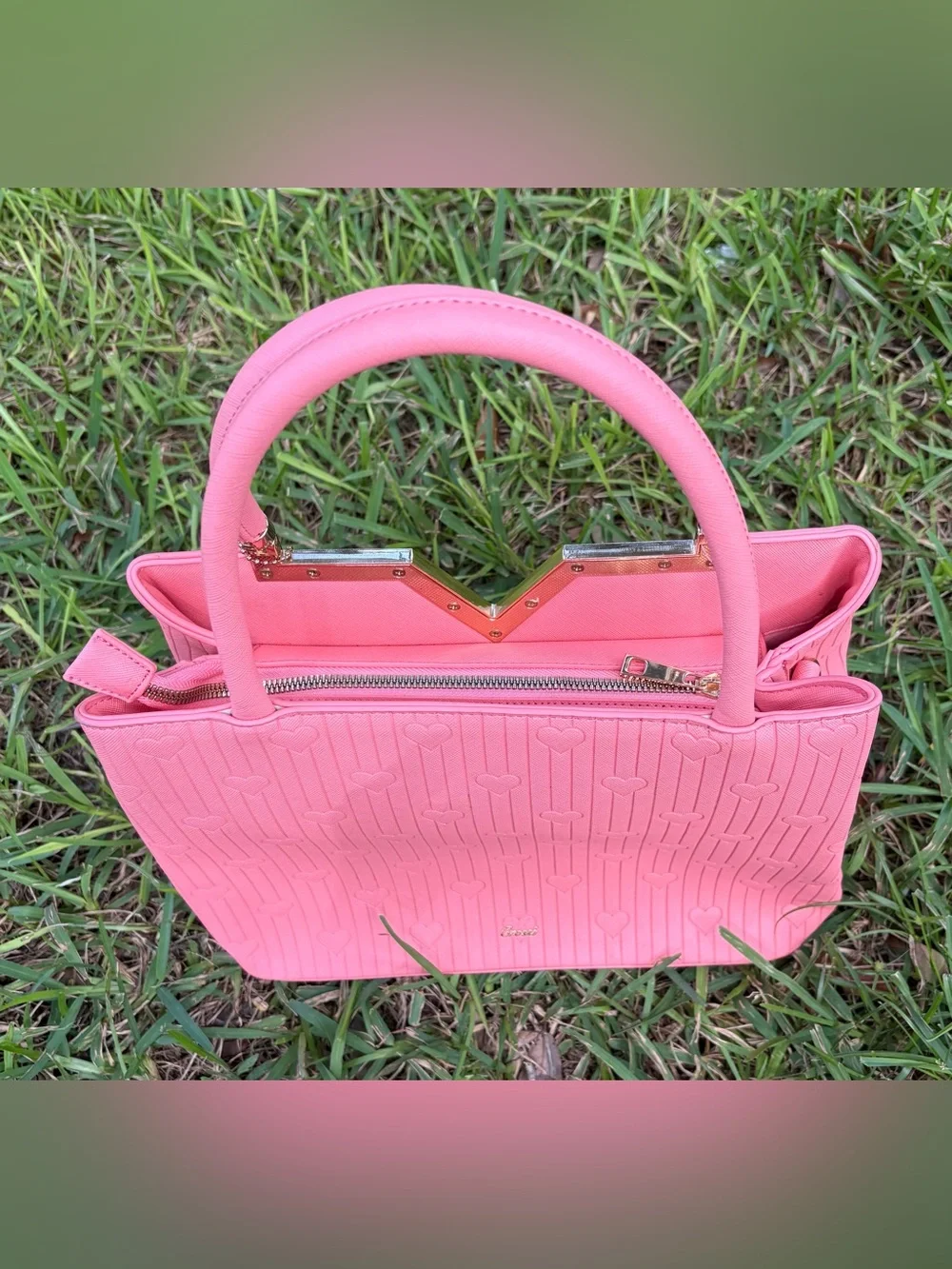 Crossi Pink Structured Heart-Embossed Tote Bag with Tassel Charm